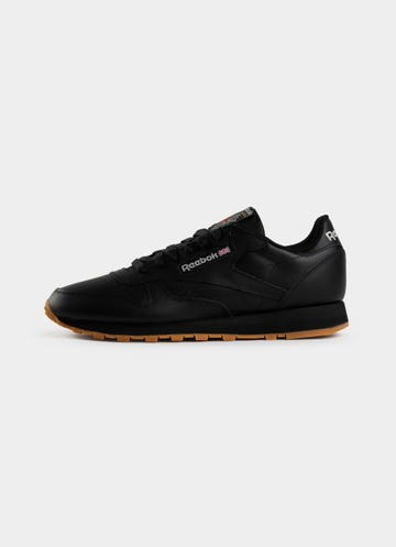 Charles Keasing evitar Bombero Reebok Classic Leather Shoes in Black | Red Rat